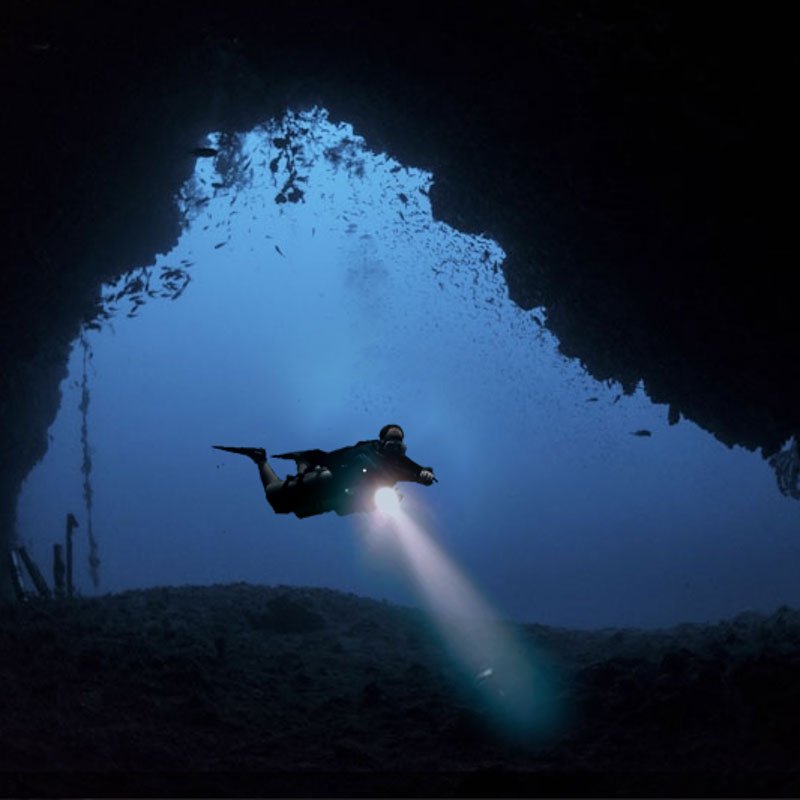 Mapting Cave Entrance with diver with torch