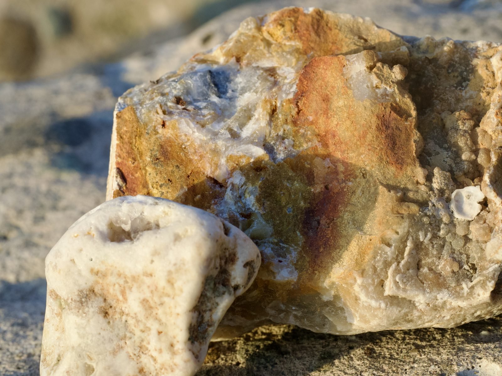 Quartz and calcite specimens on the volcanic beach