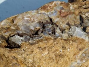 Quartz crystals embedded in volcanic rock matrix