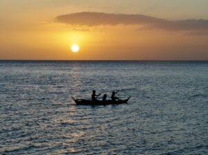 Sunset silhouette of a bangka on Balayan Bay, Anilao